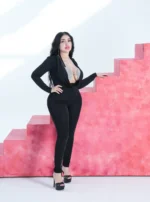 A jumpsuit with an open design and a shiny silver bustier - Image 2